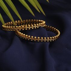 Description: Inspired by the rich tribal culture, this bangle by Tarinika is eclectic and has an earthy feel to it. It is gold plated with oxidized finish to give the definite earthy charm. Style with other jewelry from Maati Collection for a complete look. Details & Specifications: Materials used: Brass Alloy with Antique Gold Plating Weight -Bangles: 2.6- 45 gm Length - Bangles: 2.6- 6 cm Make it custom Want to make it a custom bangle? Sure! Reach out to us at support@tarinika.com and we’ll be White Gold Bangles, Simple Gold Bangle, Vintage Indian Jewelry, Kada Bangles, Gold Kada, Bangles And Bracelets, Gold Bangles Indian, Indian Wedding Jewelry Sets, Gold Bracelet Simple