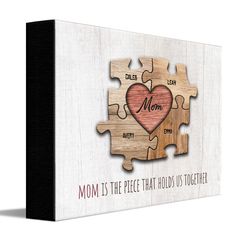 a wooden puzzle with the words mom is the piece that holds us together