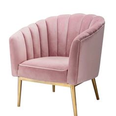 a pink velvet chair with gold legs