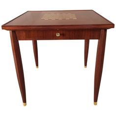 a small wooden table with chess board on it's top and drawer at the bottom