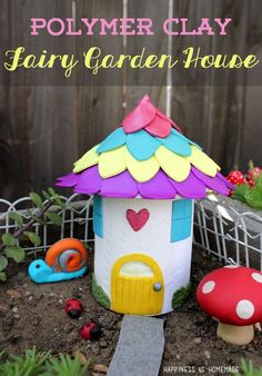 a fairy garden house made out of clay with the words polymer clay fairy garden house