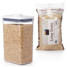 a bag of grain next to a plastic container filled with it's own food