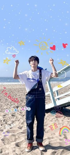 a young man standing on top of a sandy beach