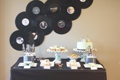 a table topped with lots of black and white plates