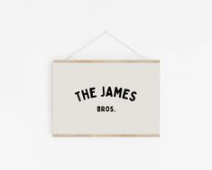 a sign hanging on the wall that says, the james bros and is written in black