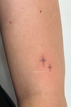 a small star tattoo on the thigh