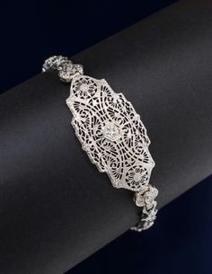 Vintage 14k White Gold Filigree Diamond Bracelet Metal: 14 Karat White Gold Stone: Diamonds at 0.33 carat total weight. Links Width: 3mm - 6.50mm  Length: 8"  Clasp: Fold over clasp with safety chain. Boone Nc, Bracelet Metal, Safety Chain, Gold Stone, Gold Filigree, Metal Bracelets, Fold Over, Chain Link Bracelet, Link Bracelets