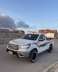 a white truck is parked on the street