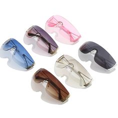 Enhance your style with our Y2K Baddie Sunglasses, suitable for all face shapes including round, long, square, oval, small, and big. Our lenses have a MIRROR, gradient, and UV400 optical attributes made from high-quality plastic. These sunglasses have a lens width of 70mm and a lens height of 39mm, making them the perfect eyewear for anyone. Our frames are crafted with durable alloy material and proudly bear the HBK brand name. Upgrade your fashion game with our Y2K Baddie Sunglasses today! Trendy Rimless Shield Sunglasses With Anti-reflective Coating, Trendy Rimless Shield Sunglasses, Trendy Rimless Polycarbonate Sunglasses, Trendy Rimless Shield Sunglasses With Uva Protection, Trendy Shield Sunglasses With Gradient Glass Lenses, Trendy Clear Shield Sunglasses In Glass, Trendy Clear Glass Shield Sunglasses, Trendy Pink Shield Sunglasses, Trendy Pink Shield Sunglasses With Glass Lenses