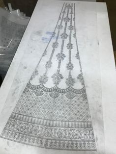 an intricately designed piece of cloth is on display