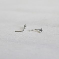 small silver earrings on white background