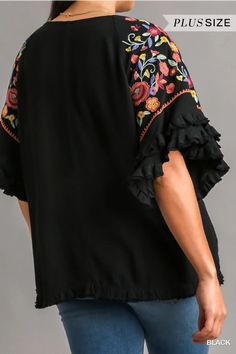 Step up your fashion game with our Floral Embroidered Round Neck Top! Crafted from a luxurious blend of 55% linen and 45% cotton, this top offers both comfort and style. The full front and back of this gorgeous top is a lovely solid go with anything black which provides a chic backdrop for the vibrant, multi-colored embroidery on the sleeves. The unfinished frayed hem adds a trendy, casual touch. Perfect for any occasion, this top is sure to become a staple in your wardrobe. Models are wearing s Cotton V-neck Blouse With Embroidered Hem, Bohemian Rayon Tops With Floral Embroidery, Bohemian Rayon Top With Floral Embroidery, Spring Embroidered Rayon Blouse, Spring Cotton Embroidered Sleeve Top, Spring Rayon Blouse With Floral Embroidery, Casual Linen Tops With Floral Embroidery, Spring Floral Embroidered Rayon Blouse, Chic Embroidered Tops For Vacation