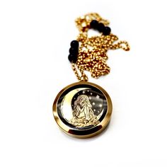 Handcrafted one-of-a-kind necklace, a beautiful vintage truly unique locket with a black onyx backing, gold leaf long haired goddess with a giant moon and twinkling stars, pendant measuring 1.5” on a vintage chain with black onyx gemstones throughout. Wear this eye catching piece casually with jeans and a t-shirt or dressed. The Necklace measures 30" in length Vintage brass chain Vintage locket pendant Made with love in Los Angeles Complimentary gift wrapping provided All sales final. Black Spiritual Necklace With Coin Pendant, Spiritual Black Coin Pendant Jewelry, Black Spiritual Jewelry With Coin Pendant, Black Spiritual Jewelry With Locket, Black Spiritual Locket Jewelry, Spiritual Black Locket Jewelry, Unique Locket, Star Goddess, Vintage Locket