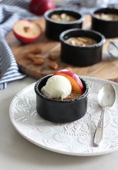 an apple dessert with ice cream and nuts on a plate