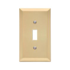 a light switch cover with two metal buttons