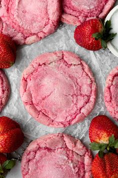 strawberry shortbread cookies with powdered sugar and fresh strawberries on the side, ready to be eaten