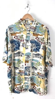 "-Description- >colorful island resort print men's hawaiian shirt >button front >collared >button close pocket on the front >mens XL >awesome print! >condition: great >color(s): multi >fabric(s): 100 rayon >brand: preswick & moore >care: machine wash -Measurements- >size: XL ✩ all measurements are taken with the item laying flat & some sizes are estimates so please check measurements ✩ chest: 50\" / 127cm length: 31\" / 78cm shoulder to sleeve end: 11\ Printed Collared Hawaiian Shirt For Beach Season, Patterned Hawaiian Shirt With Camp Collar, Multicolor Hawaiian Shirt For Beach Season, Collared Hawaiian Shirt With Tropical Print, Patterned Camp Collar Hawaiian Shirt, Multicolor Hawaiian Beach Shirt, Patterned Hawaiian Beach Shirt, Collared Hawaiian Shirt With Graphic Print For Vacation, Patterned Hawaiian Shirt For Beach