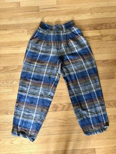 Most amazing women’s vintage express plaid gaucho pants High waisted Buttons at waist and zipper fly Side pockets No pockets in back Excellent vintage condition Ramie and rayon material Tag reads size 7/8 Measurements taken flat are Waist: 12.5 in Hips: 16 in Rise: 16 in Inseam: 26 in Full length: 39.5 in longAll sales are final Thanks for checking out Cereal Vintage Thrift Recycle Reuse Recreate Plaid Tapered Leg Bottoms For Fall, Tapered Leg Plaid Bottoms For Fall, Retro Plaid Bottoms With Pockets, High Waist Plaid Cotton Bottoms, Plaid Cotton High-waisted Pants, Vintage High Waist Plaid Bottoms, Casual Plaid Bottoms With Belt Loops, Vintage Relaxed Fit Pants With Elastic Waistband, Vintage Wide Leg Plaid Bottoms