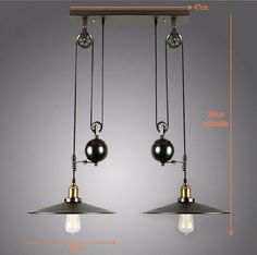 two pendant lights hanging from the ceiling with one light on each side and an attached bulb