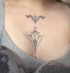 a woman with a tattoo on her chest