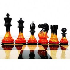 a set of chess pieces sitting on top of a table