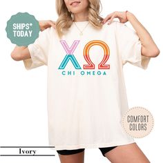 a woman wearing a shirt that says xo chi omega