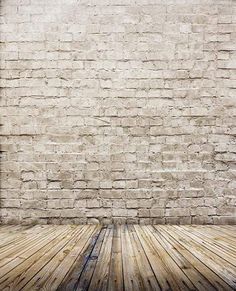 an old brick wall and wooden floor