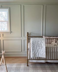 a baby crib in the corner of a room