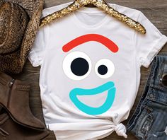 a t - shirt with an image of a smiling face on the front and side