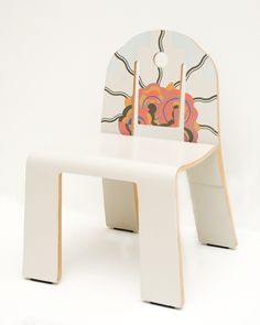 a white plastic chair with an abstract design on the back