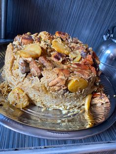 there is a cake that has been made with nuts and other toppings on it