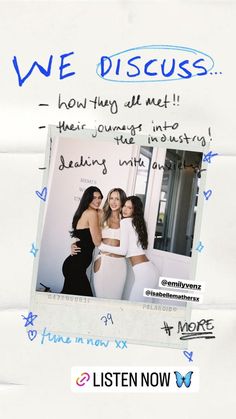 two women standing next to each other in front of a white wall with blue writing on it