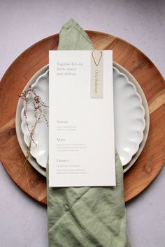 the place setting is ready to be served at this wedding reception, with an elegant menu