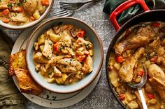 two bowls filled with chicken and vegetables next to bread on a table, one has a fork in it