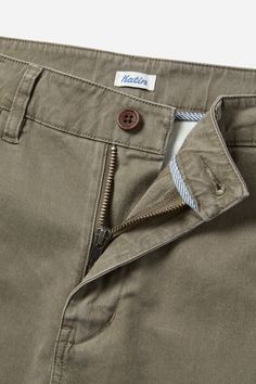 The Corey Chino Pant boasts a Tencel Cotton blend fabric, a fixed waistband, welt back pockets, and clean-finished interior seams. With a 15" leg opening on size 32, it offers both style and functionality. 55% Tencel, 42% Cotton, 3% Spandex stretch chino Slim straight fit 32" inseam 15" leg opening Fixed waistband Front slash pockets Back welt pockets | Corey Chino Pant Men's Size 34 Cotton in Elmwood by Katin Fitted Tapered Leg Work Pants With Patch Pockets, Classic Straight Bottoms With Patch Pockets, Fitted Chinos With 5-inch Inseam And Pockets, Everyday Bottoms With Belt Loops And Standard Cut Leg, Spring Pants With Welt Pockets And Standard Cut, Chinos With Pockets And 5-inch Inseam, Slim Fit Chino Bottoms With Pockets, Slim Fit Flat Front Chinos With Pockets, Fitted Straight Leg Chinos With Patch Pockets