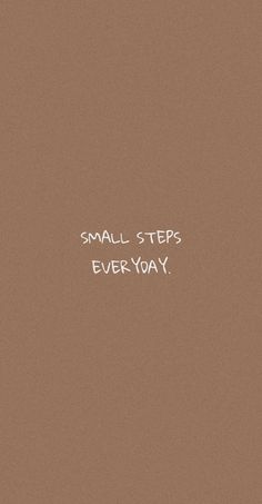 the words small steps everyday are written in white ink on a brown background with black and white writing