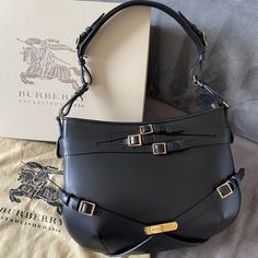 Authentic Burberry Bridle Dutton Handbag, All Leather, Black With Nova Check Plaid Interior. This Bag Is Absolutely Gorgeous And Structured - Perfect For Dressing Up For Business Events Or Everyday. New With Tags, Dust Bag, And Box. Shipped With Usps Priority Mail. Any Questions? Ask Me! Burberry Bags Handbags Black, Burberry Handbags Crossbody, Burberry Tote Bag, Burberry Purse, Burberry Print, Folding Sunglasses, Burberry Shoulder Bag, Burberry Tote, Louis Vuitton Pochette Metis