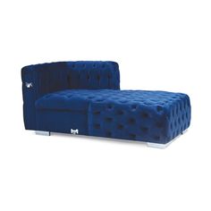 a blue couch sitting on top of a white floor