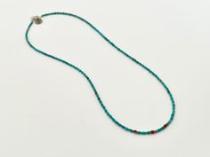 This delicate turquoise necklace is the perfect layer and will add a stunning touch of color to any necklace game. A lovely strand of tiny turquoise beads is dotted with three coral beads for interest. Turquoise is a purification stone. It dispels negative energy and is worn to help stabilize moods and promote inner calm. It also represents friendship and connection. Coral is an auspicious stone - or so the Buddhists would have you believe. Coral represents diplomacy, harmony and inner peace. It Blue Turquoise Necklace With Tiny Beads For Gift, Holiday Promotions, Coral Necklace, Coral Beads, Coral Turquoise, Turquoise Beads, Negative Energy, Inner Peace, Turquoise Necklace