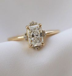 an engagement ring with a cushion cut diamond