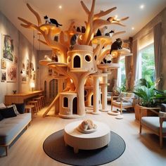 a living room filled with lots of furniture and cats on top of the tree house