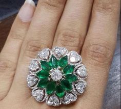 Specification:- *Diamond Type : Cubic Zirconia (CZ) *       Diamond Shape : Round, Marquise, Heart Cut *Total Diamond Weight : 7.12CT (Approx.) *Center Diamond Measurement : 7*3.50 MM *Center Diamond Weight : 3.50CT *Side Diamond Measurement : 1.10, 1.70, 2.10, 4.00MM  *Side Diamond Weight : 3.62CT *Diamond Color : White, Green *Diamond Clarity : VVS *Making Process: Handmade by our Experienced Staff. *Stamp: Our All Rings Stamped According to metal Purity (925 SIL/10K/14K/18K). Customization:- *Buyer can Request change of rhodium color in 925 Silver Jewelry (No additional Charge). *In Gold (10K, 14K, 18K) buyer can change gold color (White, Rose, Yellow). *Buyer can also change CZ Stone Color (No additional Charge). Custom Order:- *We do Accept Custom order. *Buyer can also request custom Marquise Wedding Ring, Princess Ring, Hand Ring, Emerald Jewelry, 925 Silver Jewelry, Diamond Jewellery, Bridal Rings, Cocktail Ring, Cocktail Party