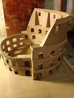 a cardboard model of a castle made to look like it's been built into the ground