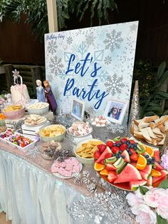 a table filled with lots of food and desserts