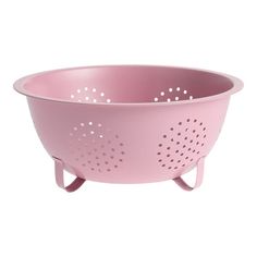 a pink colander with holes in it