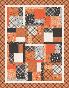 an orange and black patchwork quilt