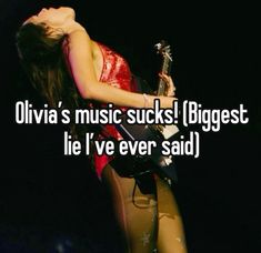 a woman in tights holding a guitar with the caption, olvia's music sucks biggest lie i've ever said