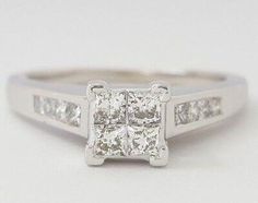 a white gold engagement ring with princess cut diamonds