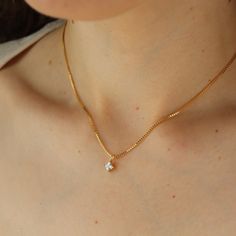 Meet the Quinn Necklace– a modern, yet timeless accessory that's the perfect finishing touch to your holiday look. Our sleek gold chain is embellished with a sparkly, square-cut cubic zirconia that's beautifully set in 14k gold fill. DETAILS14k gold fillAvailable in 16", 18", or 20"Cubic zirconia square pendantHypoallergenic and nickel free Gold Cubic Zirconia Diamond Necklace Tarnish Resistant, Dainty Solitaire Necklace With Diamond Accents In Cubic Zirconia, Fine Jewelry Solitaire Necklace With Delicate Chain, Everyday Gold Solitaire Necklace With Single Diamond, Formal Solitaire Necklace With Delicate Cubic Zirconia Chain, Diamond White Cubic Zirconia Solitaire Necklace With Delicate Chain, Classic Everyday Cubic Zirconia Necklace, Tarnish Resistant Yellow Gold Cubic Zirconia Chain Necklace, Anniversary Cubic Zirconia Solitaire Necklace With Delicate Chain