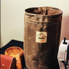 This is an extra large and extra wide size handmade waxed canvas round bottom bag. It measures 13" high, 8" wide, and a bottom circumference of 25". It is perfect for just about any gear, including cooking gear (billy can, solo stove, etc.). It also features a para-cord drawstring closure threaded through brass eyelets, with a spring loaded cinch. This bag also has an outer waxed canvas pocket. Great for utensils, fire starter, etc. Everything is double stitched! This bag is made from our 14.1 o Bushcraft Stove, Foraging Bag, Cooking Over Fire, Solo Stove, Hunting Bags, Survival Camping, Fire Starter, Camping Bag, Sleeping Bags